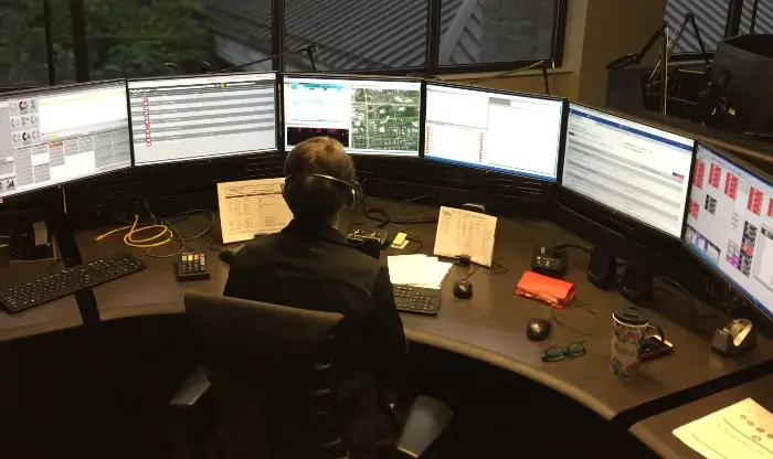 9-1-1 call-taker at communications console
